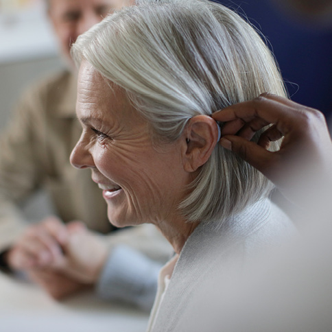 Woman being fit with a hearing aid