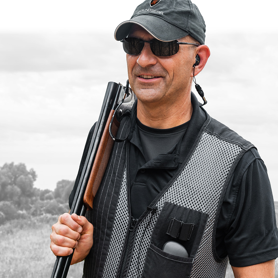 man hunting wearing hearing protection