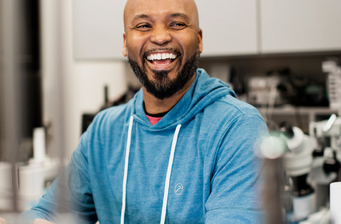 A smiling lab technician