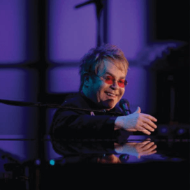 Starkey History 2004 - Elton John helps raise money