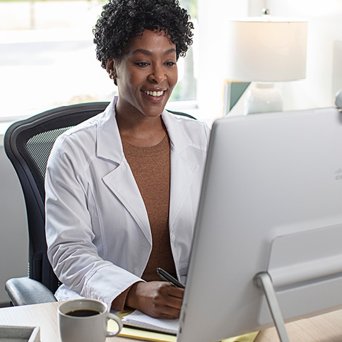 Woman audiologist at a computer