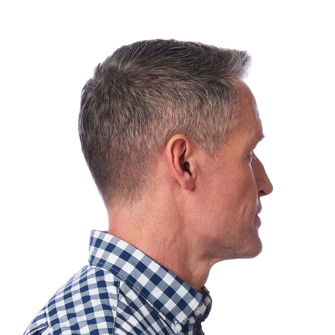 An CIC non-wireless hearing aid shown in a man's ear