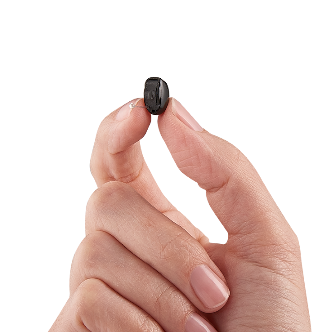 An IIC hearing aids being held in a hand