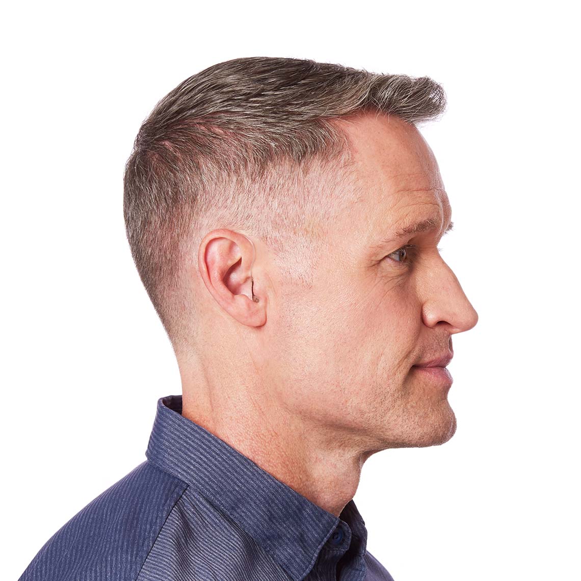 A RIC 312 AP shown on a man's ear