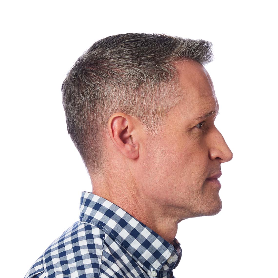 A CIC hearing aid shown in a man's ear