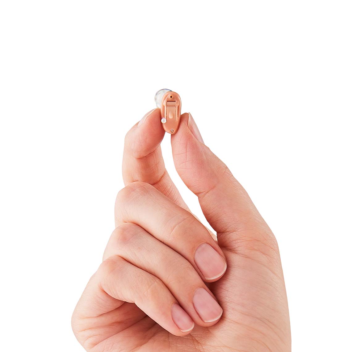 A hand holding a CIC hearing aid