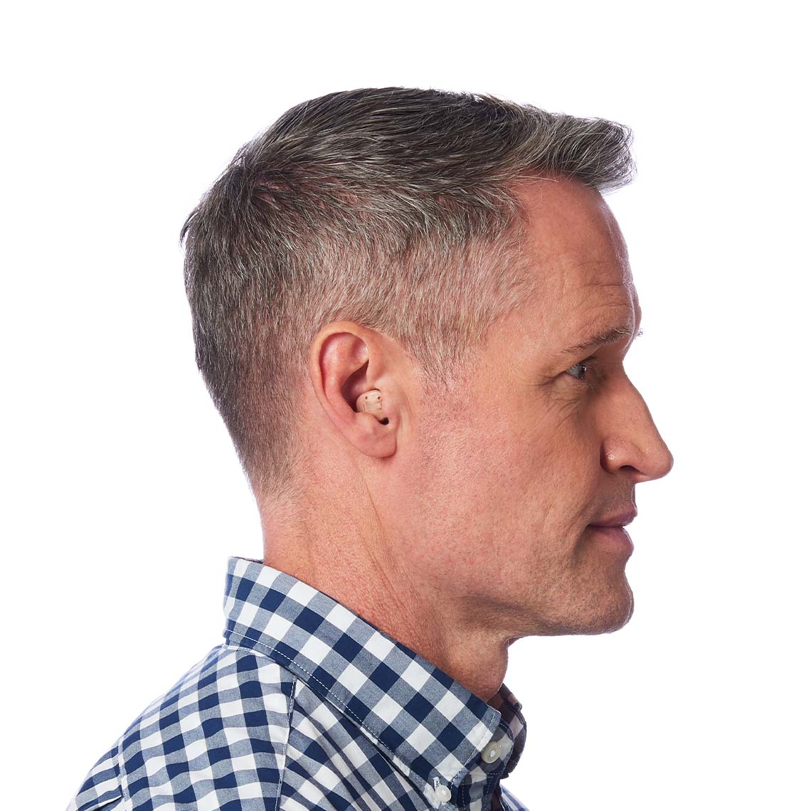A ITC hearing aid shown in a man's ear