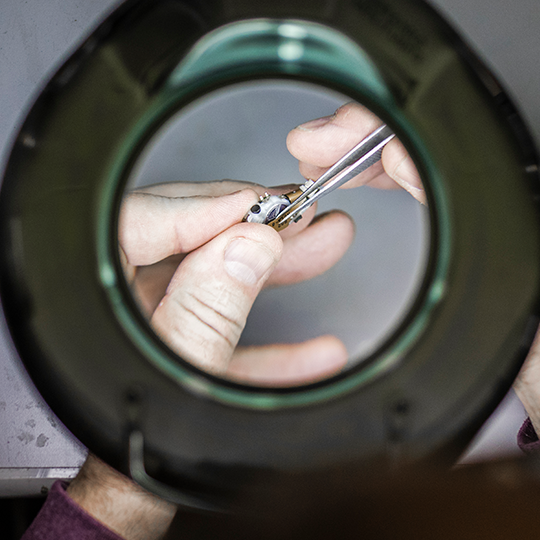 Hearing aid being repaired.