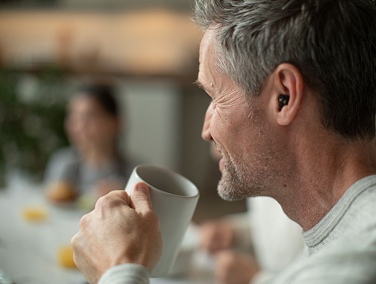 Man drinking coffee.