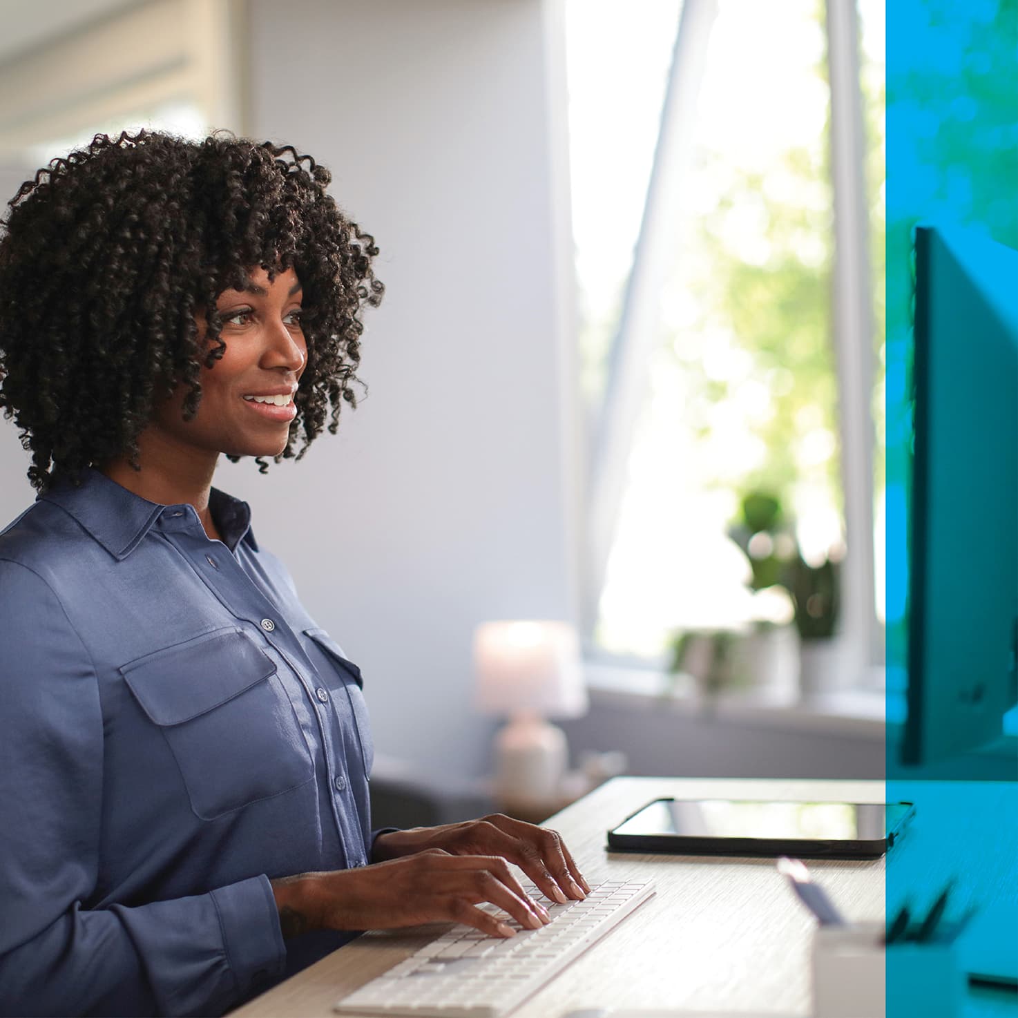 woman typing at a computer